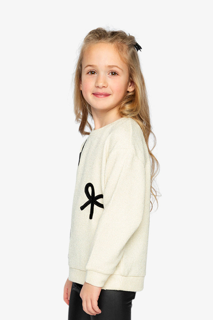 Deux par Deux beige and black sweatshirt with velvet bows, second lookbook view