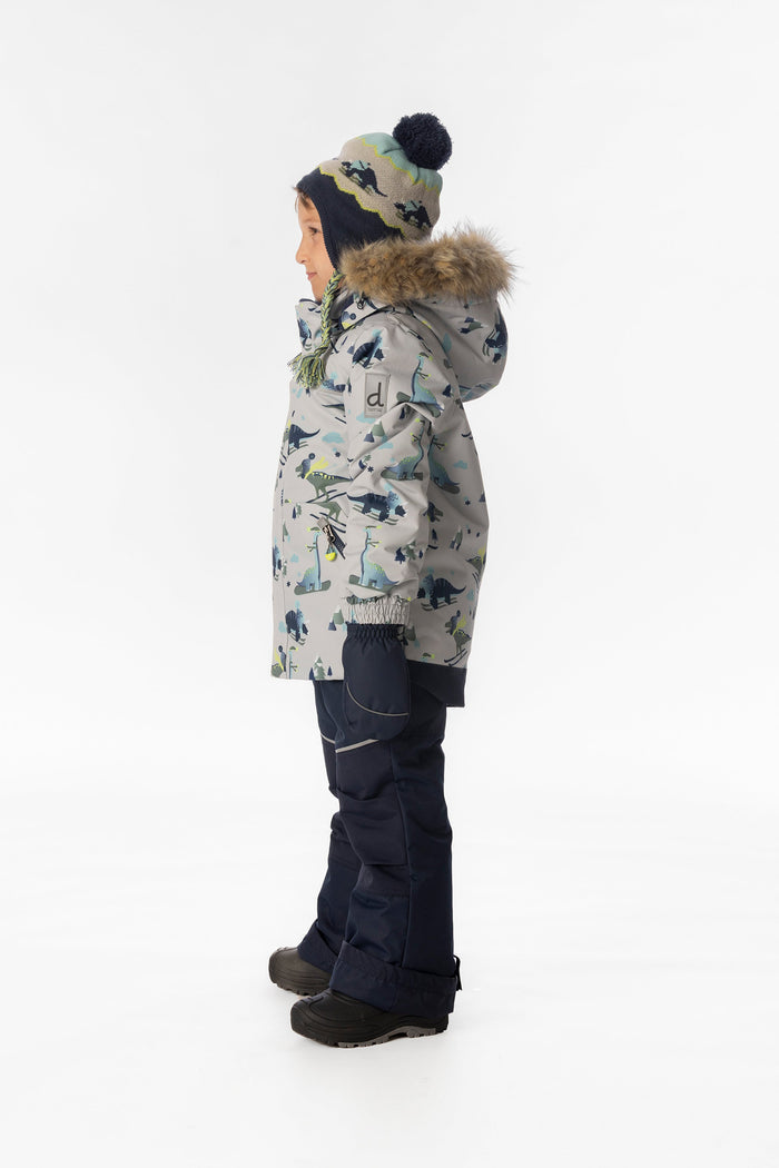 Child wearing the grey dinosaur print Deux par Deux DISCOVER snowsuit, side view