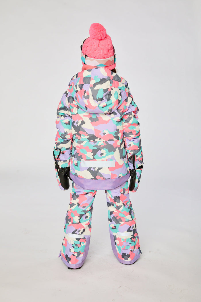 Deux par Deux girls' Teknik two-piece snowsuit in coral camouflage print with lilac panels – on a child model, another view