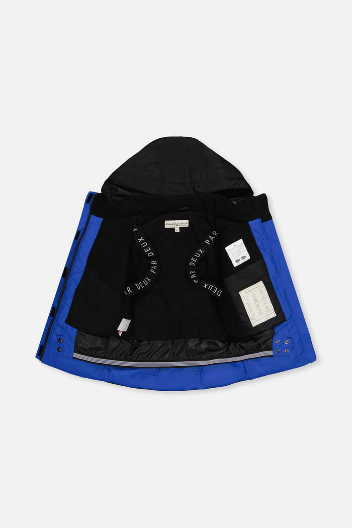Black and royal blue TEKNIK jacket open to show the black fleece lining and backpack straps