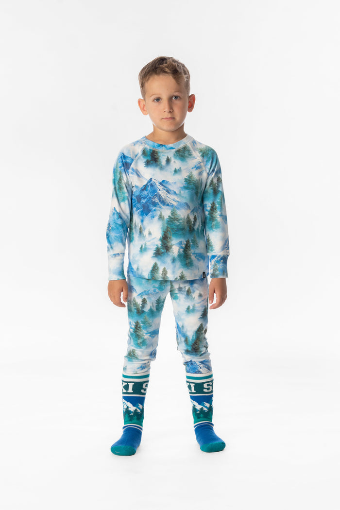 Deux par Deux boys' thermal base layer set in blue mountain print – worn by a model