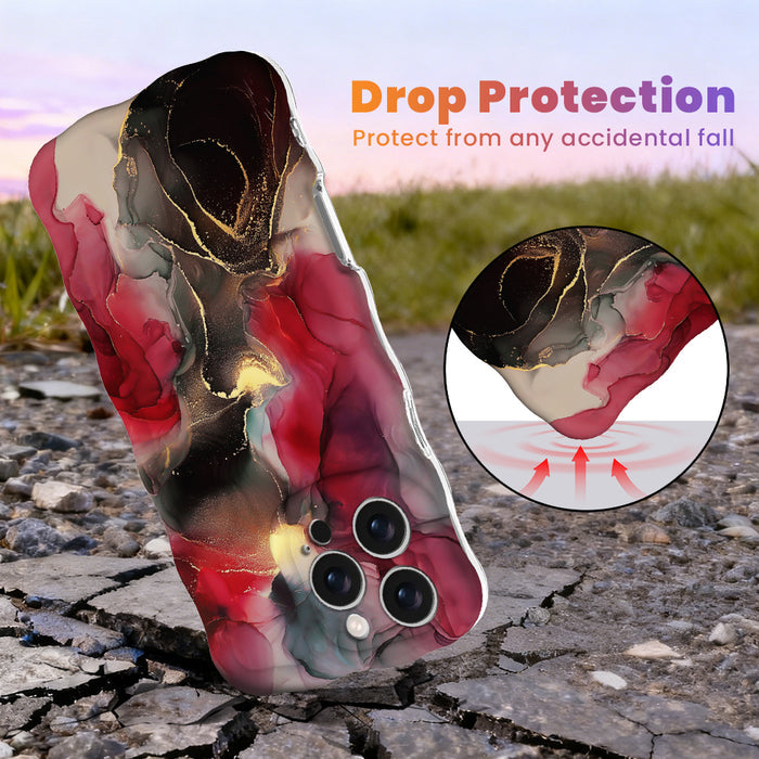 Drop protection graphic for the Velvet Vixen Wavy Luxe MagSafe iPhone case, crimson and black alcohol-ink marble with gold veining, showing the cushioned wavy edges.