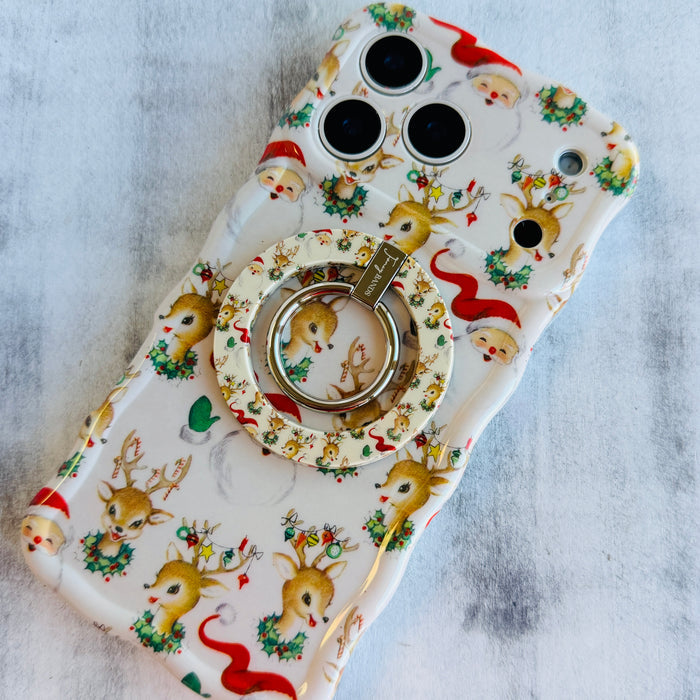 Vintage Christmas grip ring attached to the matching cream Wavy Luxe case on a grey backdrop