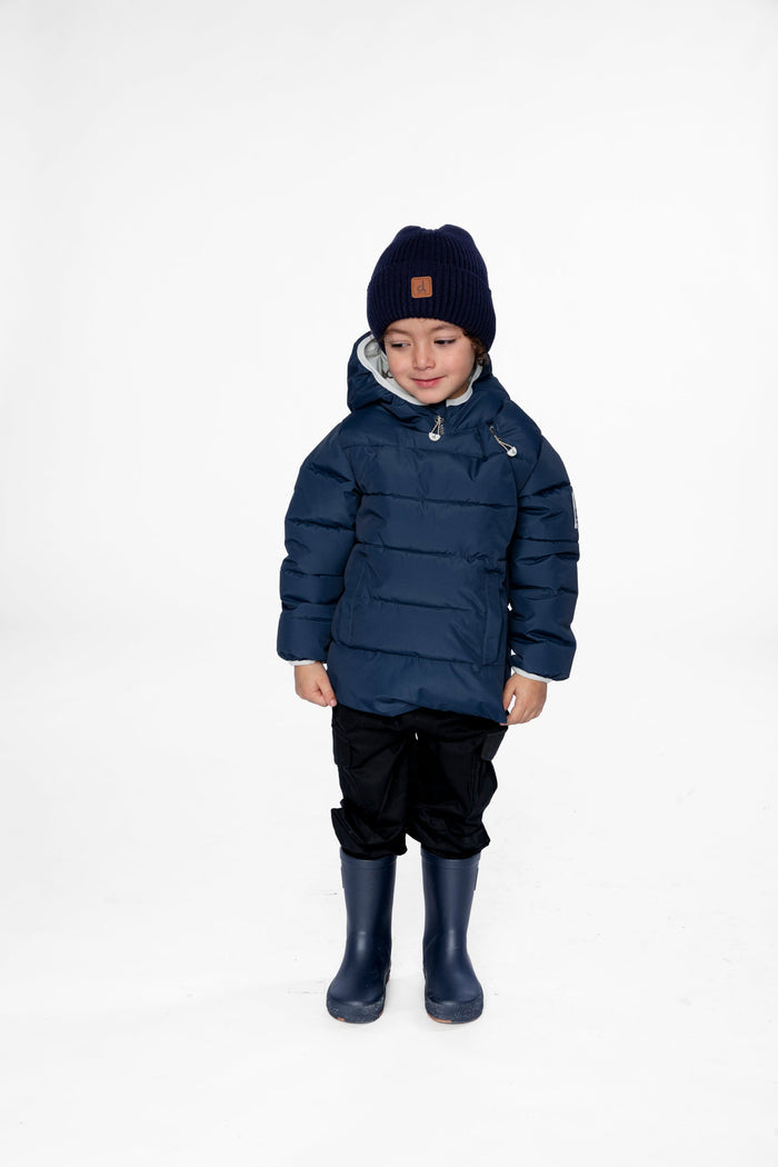 Child wearing the Deux par Deux dark blue car seat winter jacket, front view