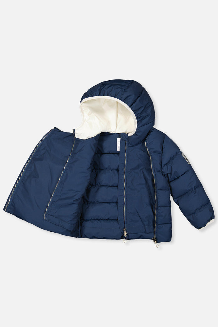 Deux par Deux winter jacket adapted for car seats, dark blue, unzipped to show the lining and faux fur-lined hood