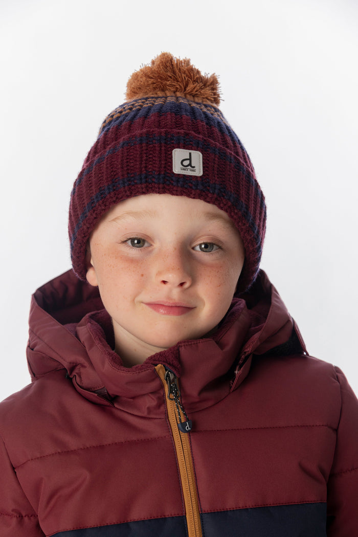 Deux par Deux boys' striped jacquard pompom hat in burgundy and brown – worn by a model