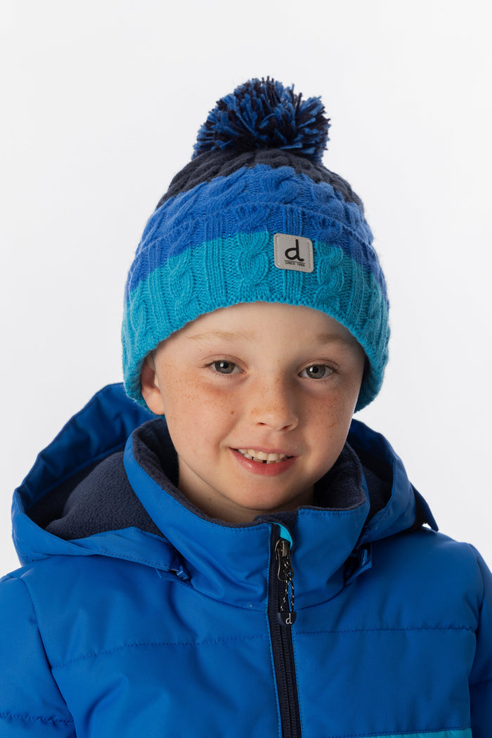 Deux par Deux boys' cable-knit pompom hat in dark blue colour block – worn by a model