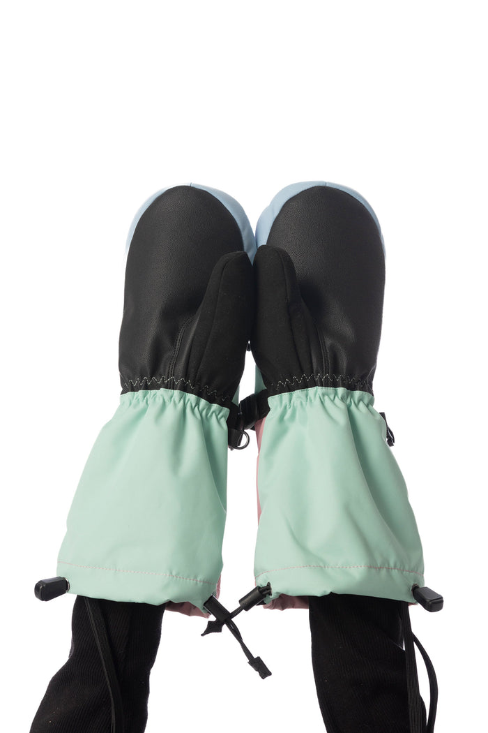 Child wearing Deux par Deux Teknik kids' mittens in mint green, palm side