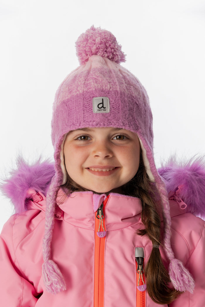 Deux par Deux kids' Peruvian cable-knit hat in pinkish violet – worn by a child
