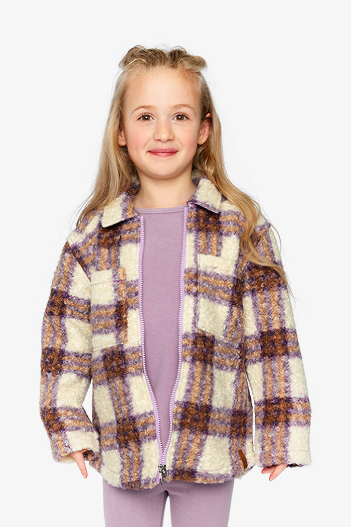 Child wearing the Deux par Deux sherpa overshirt in beige and mauve plaid, view 1