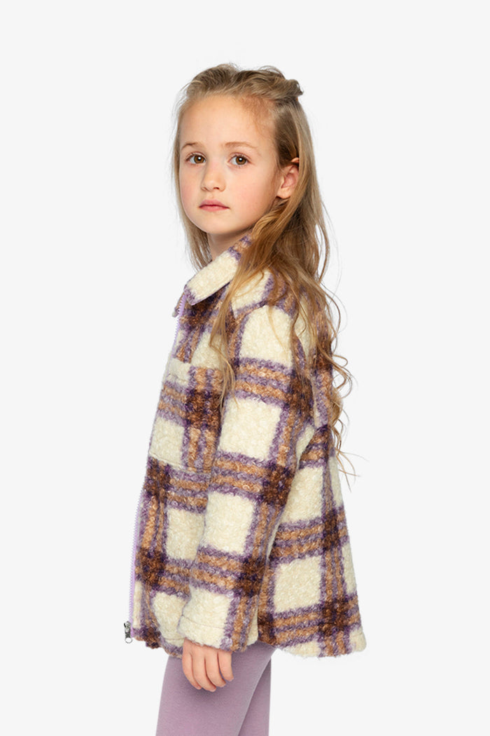 Child wearing the Deux par Deux sherpa overshirt in beige and mauve plaid, view 2